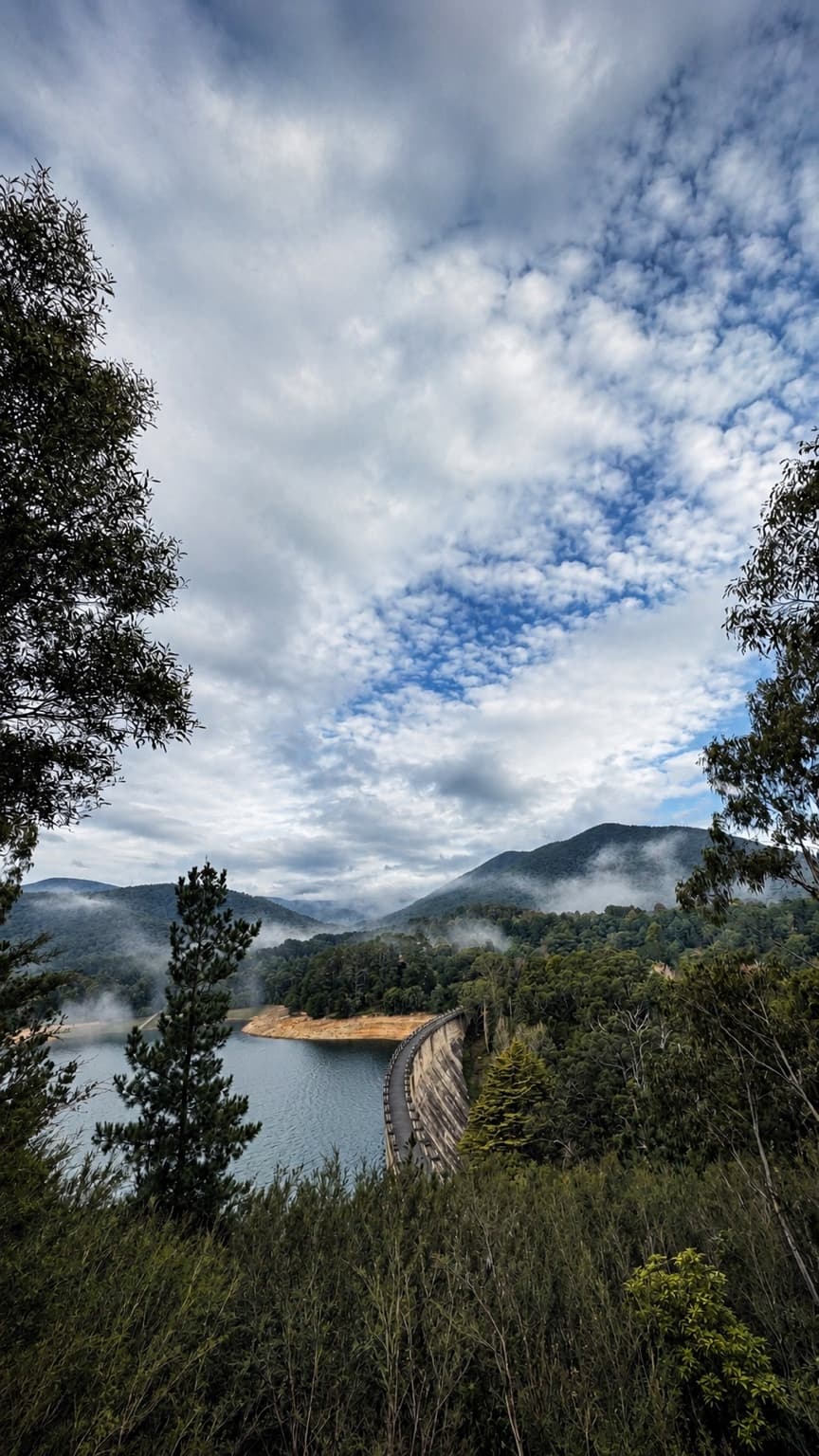 Maroondah Reservoir wall viewed from the eucalyptus-framed lookout above
