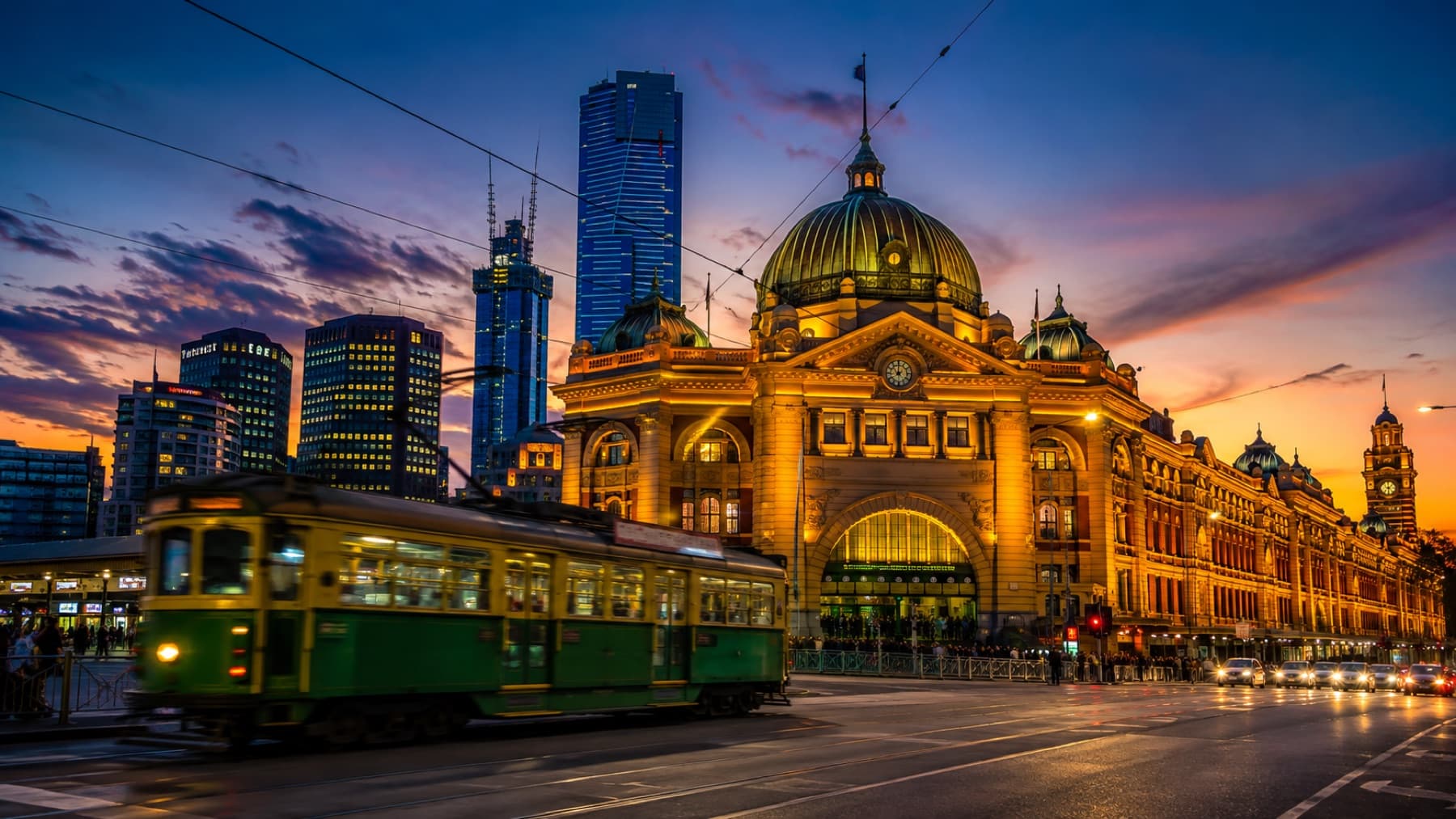 Flinders Street Station and a tram at dusk