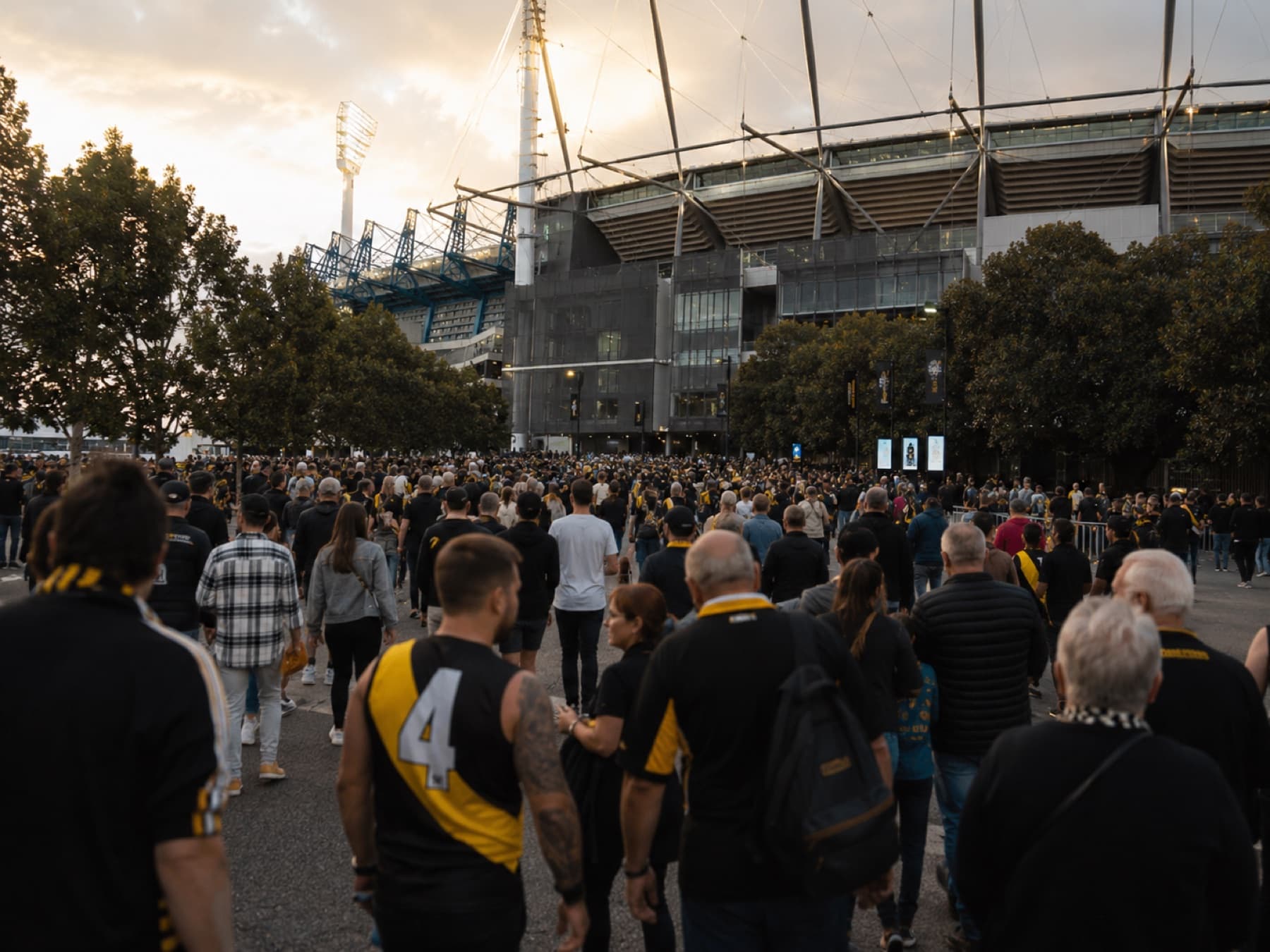 A crowd walking towards the MCG on game day